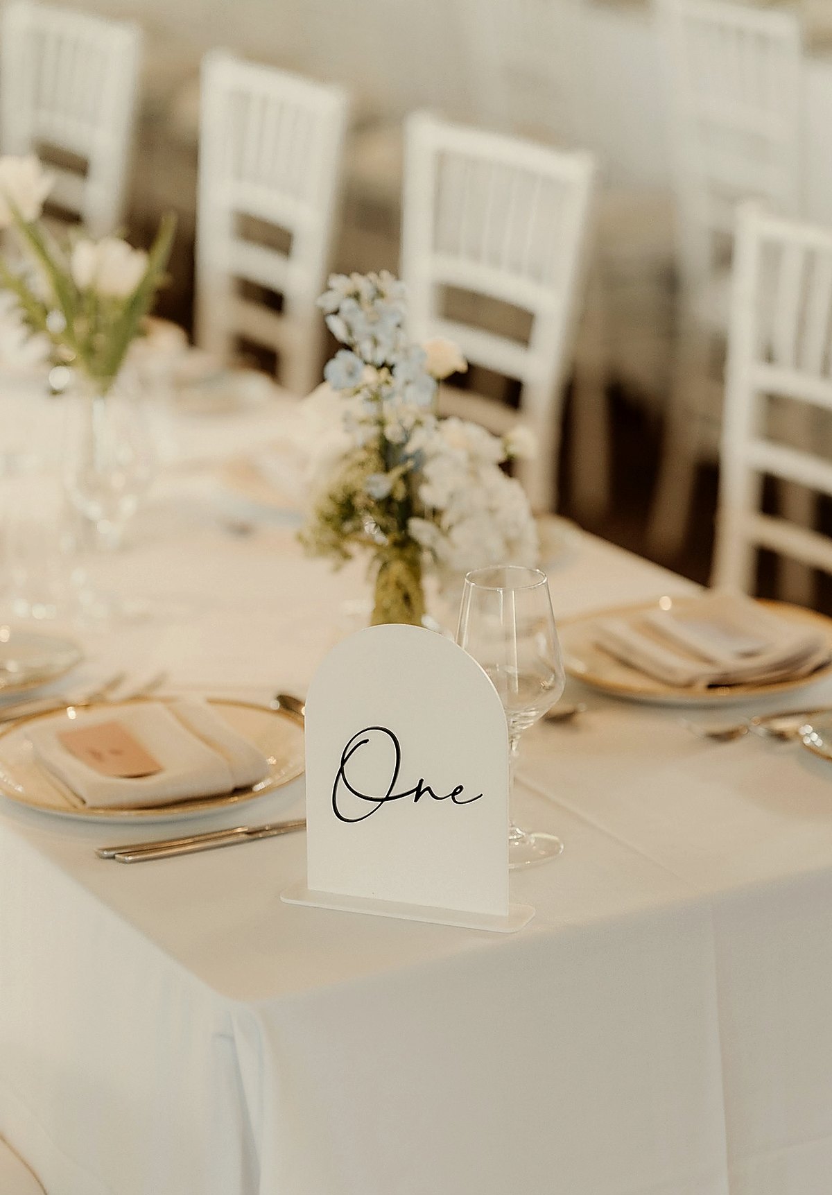 Table styling with bud vase and One sign