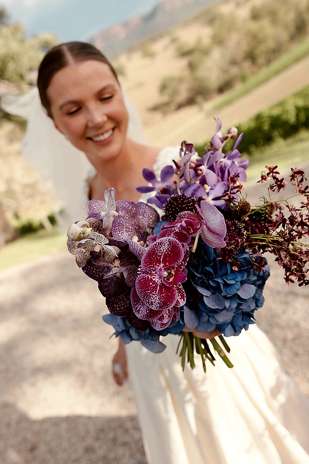 Kate and Luka — vivid purple and blue vanda bouquet